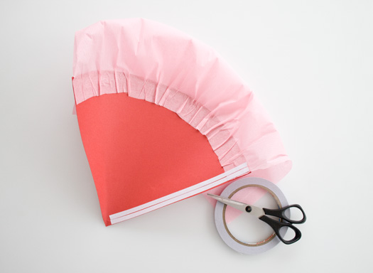 Fold back the crepe paper top and then add two close lines of double-sided tape